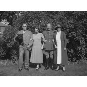  Two Couples Have their Photo Taken in the Garden Stretched 