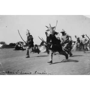 1900 Yaqui Indians dancing. Indians in traditional costumes and animal 