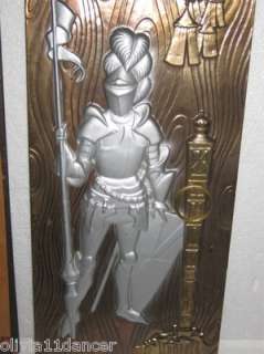 Pair metal wall hangings from the 1950s. They depict knights in their 