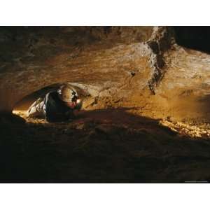 Caver Crawls Through Mammoth Cave during the Wild Cave Tour Stretched 