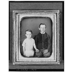  Unidentified boy in chair with child to left
