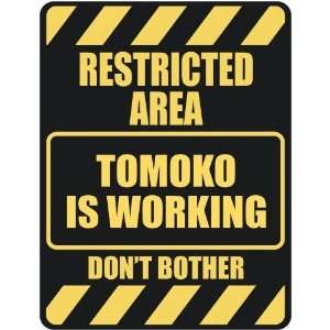   RESTRICTED AREA TOMOKO IS WORKING  PARKING SIGN