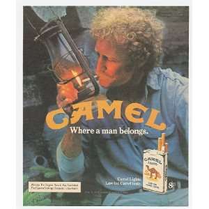   Camel Man Lighting Cigarette with Lantern Print Ad (11748) Home