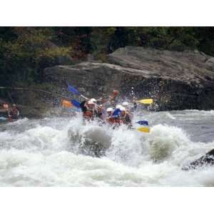 Rafters Riding the Rock Strewn Gauley River Through a Mountain Gorge 