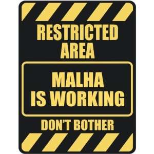   RESTRICTED AREA MALHA IS WORKING  PARKING SIGN