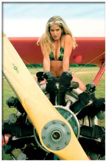 Model is sitting astride the engine cowling of a 1943 Boeing Model 