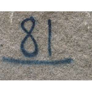  A Slab of Stone with Numbers Written in Blue Photographic 