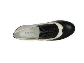 Oxford Color Black / white . Round toe, lace up front, stitching 