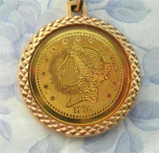  goldtone coin pendant ~ one side with the Statue of Liberty 