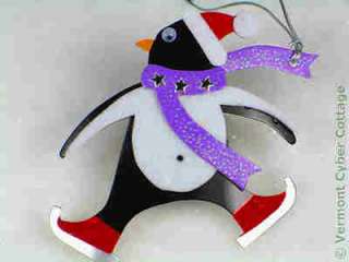 Flocked penguin with sparkly scarf & googly eyes, silver cord tie.