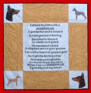 the four colors of doberman cross stitched lap quilt by donna campbell