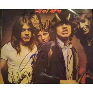   Members Angus Young, Malcolm Young, Phil Rudd, Cliff Williams. W/COA